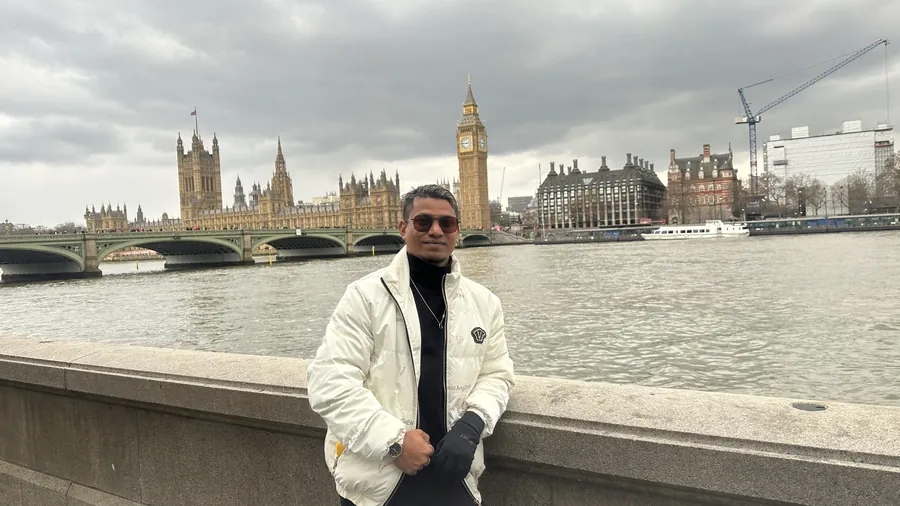 Habib by the Thames with Big Ben and Westminster behind him